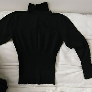 Stretchy turtleneck sweater.